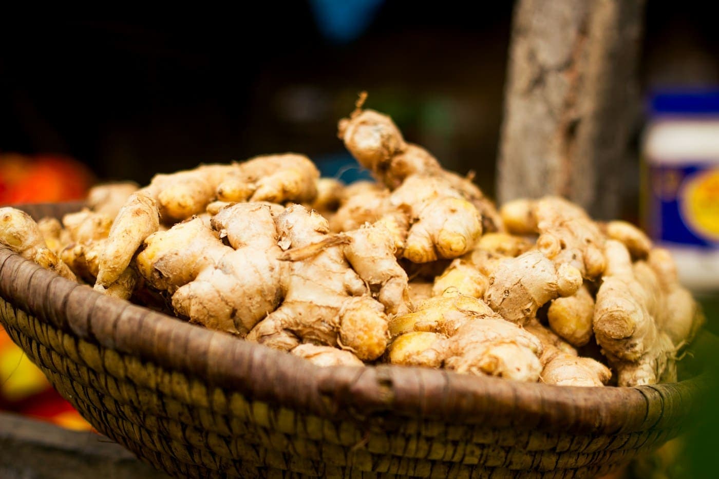 Basket of fresh ginger roots at a market